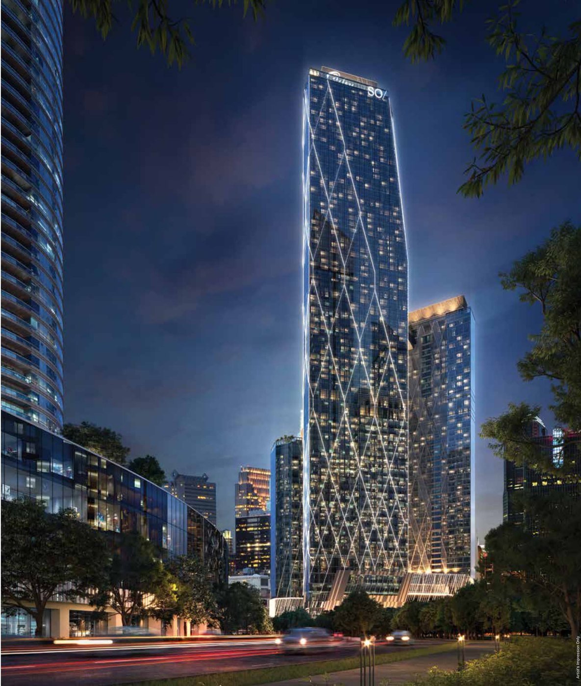 Oxley KLCC tower illuminated at night beside the Petronas Twin Towers